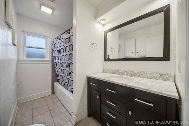 bathroom featuring vanity, shower / bath combination with curtain, and tile patterned flooring