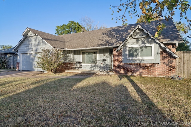 view of front of house with a front lawn and a garage