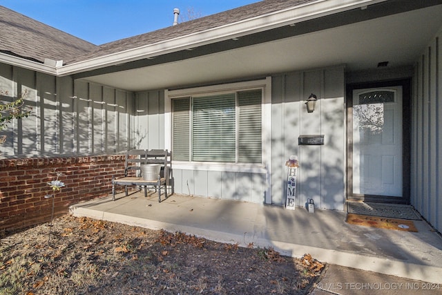 entrance to property with a patio area