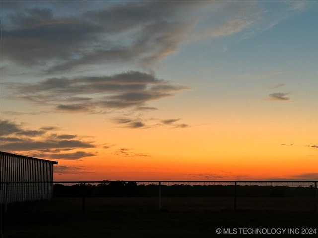 yard at dusk with a water view