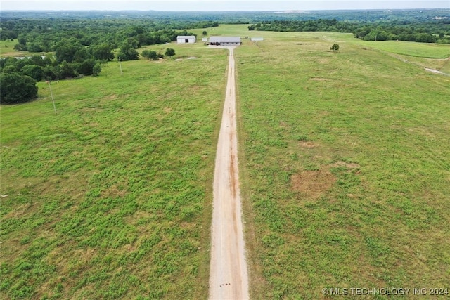 birds eye view of property with a rural view