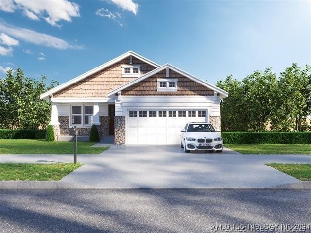 craftsman inspired home featuring a front yard and a garage