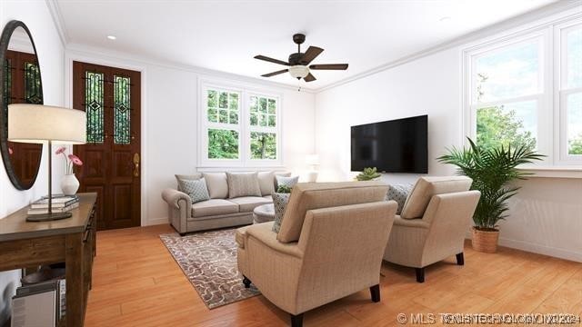 living room featuring plenty of natural light, light hardwood / wood-style floors, and ornamental molding