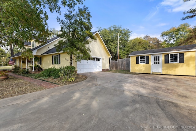 view of side of property with a garage