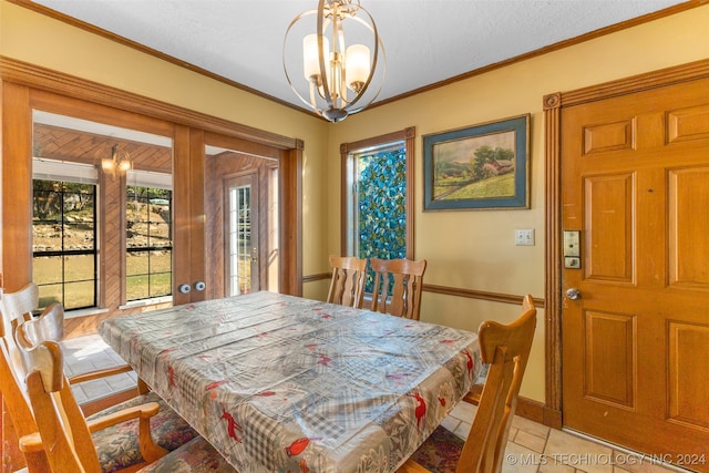 dining space with french doors, crown molding, light tile patterned flooring, a notable chandelier, and a textured ceiling