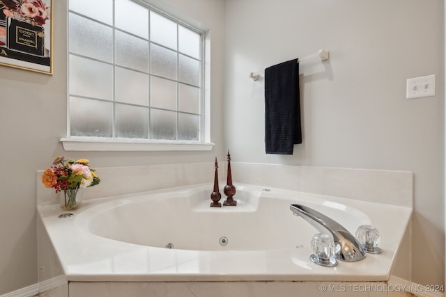 bathroom featuring a tub to relax in