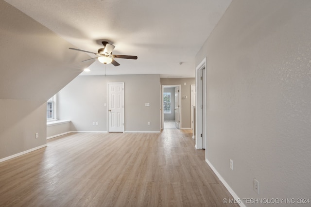 interior space with light hardwood / wood-style floors and ceiling fan