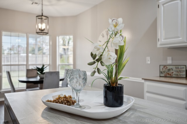 dining space with a chandelier