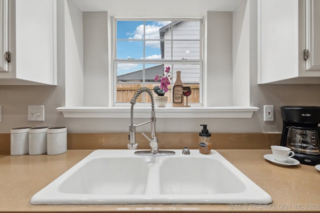 room details with sink and white cabinets