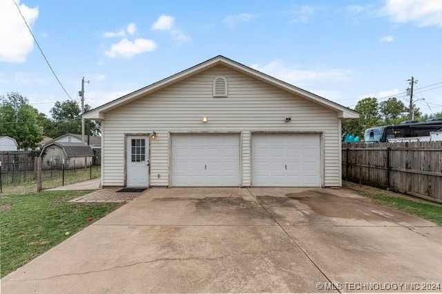 garage with a lawn