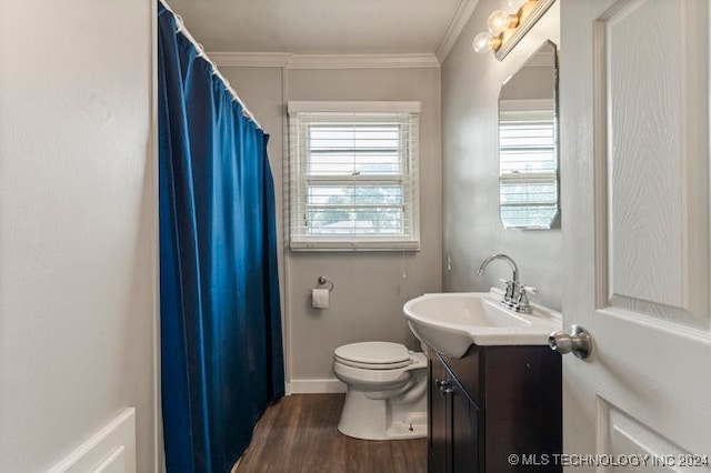 bathroom featuring vanity, crown molding, toilet, and hardwood / wood-style flooring