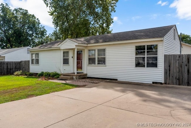 ranch-style house with a front lawn