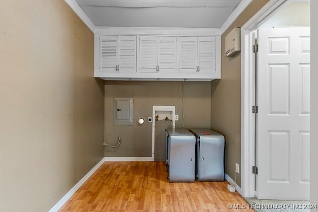 laundry room featuring light hardwood / wood-style floors, electric panel, crown molding, washer hookup, and cabinets