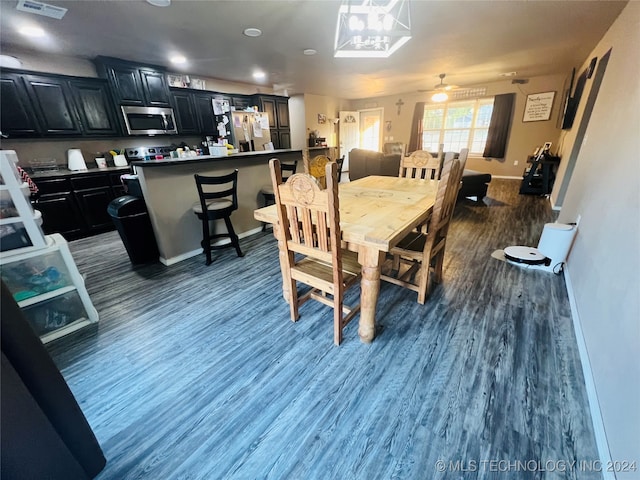 dining room with dark hardwood / wood-style floors and ceiling fan