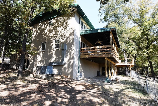 view of home's exterior featuring a deck