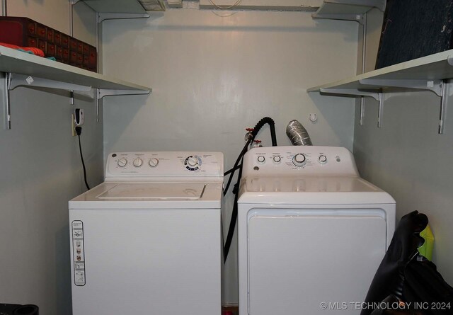 laundry area with washing machine and clothes dryer