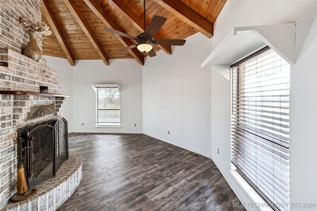 unfurnished living room featuring lofted ceiling with beams, a fireplace, dark wood-type flooring, and wooden ceiling