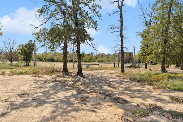 view of yard with a rural view