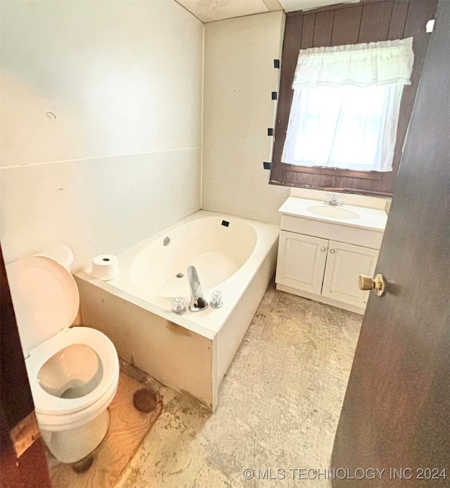 bathroom featuring toilet, vanity, and a bathing tub