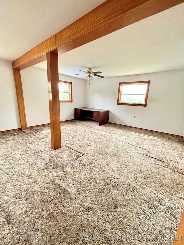 interior space featuring ceiling fan and carpet floors