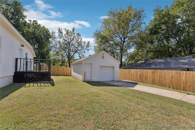 view of yard featuring an outbuilding and a garage