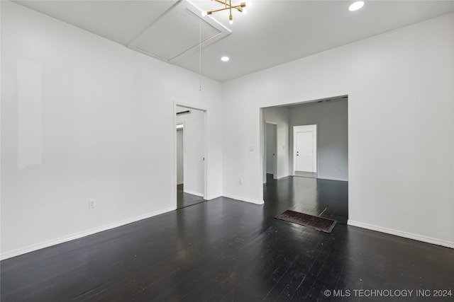 unfurnished room with dark hardwood / wood-style floors