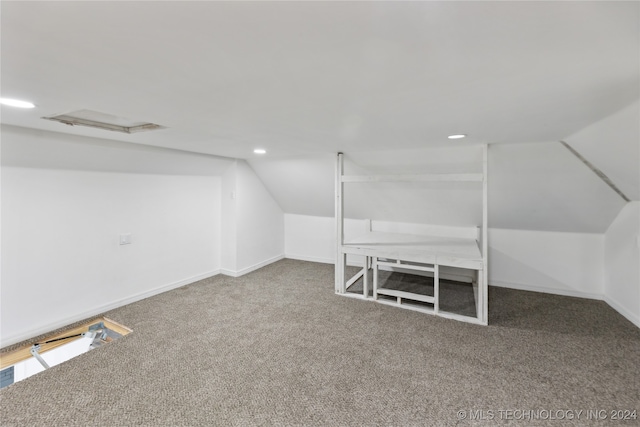 bonus room featuring lofted ceiling and carpet flooring