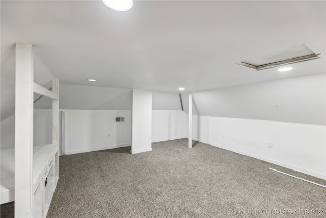 basement with dark colored carpet