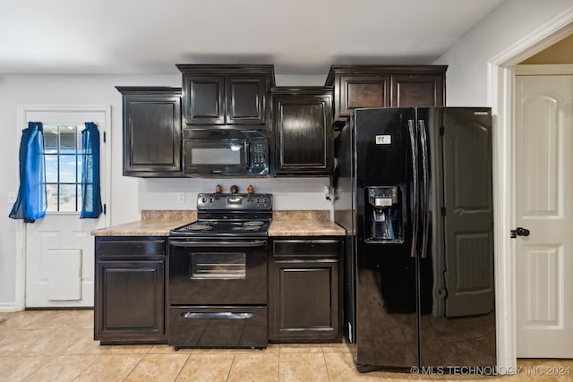 kitchen featuring black appliances, dark brown cabinets, and light tile patterned floors