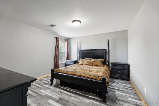 bedroom with light hardwood / wood-style floors