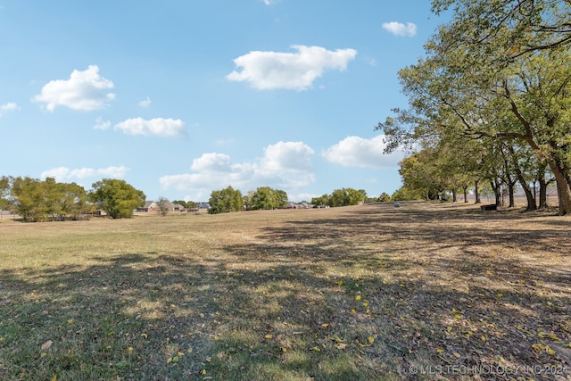 view of yard with a rural view