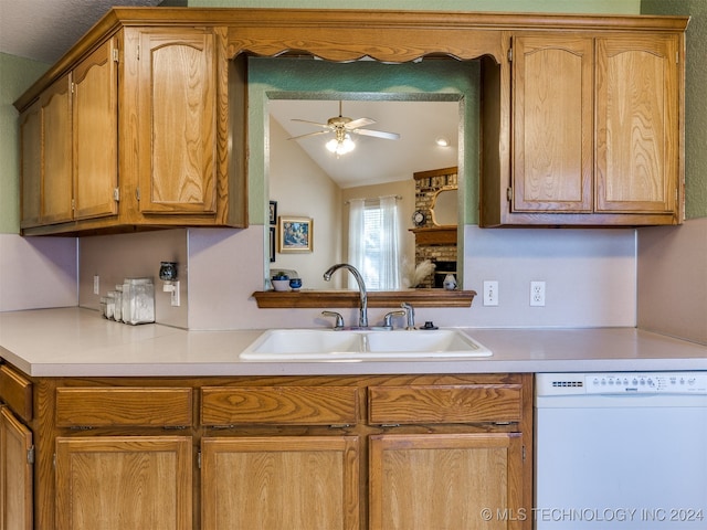 kitchen featuring dishwasher, lofted ceiling, sink, and ceiling fan