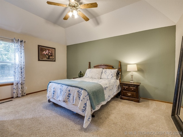 bedroom featuring ceiling fan, light colored carpet, and lofted ceiling