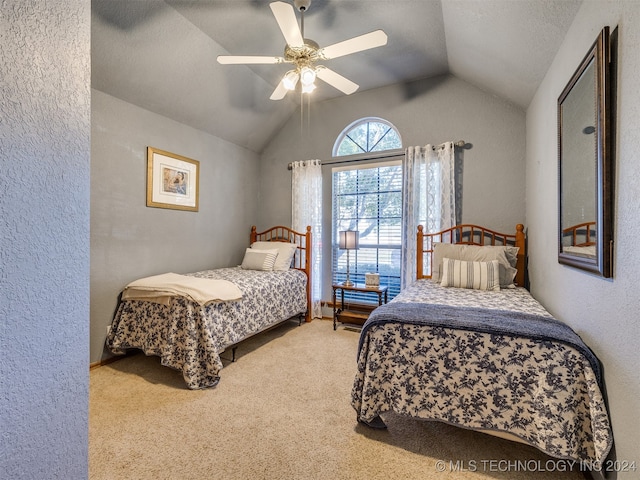 carpeted bedroom featuring ceiling fan and lofted ceiling