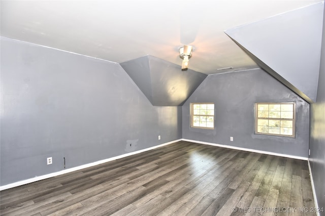 bonus room featuring vaulted ceiling and hardwood / wood-style flooring