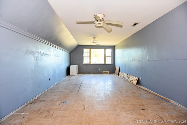 additional living space featuring ceiling fan and vaulted ceiling