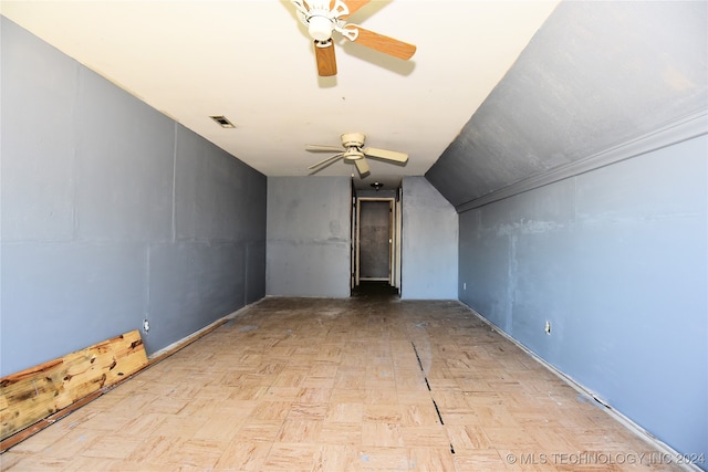 bonus room with light parquet flooring, lofted ceiling, and ceiling fan