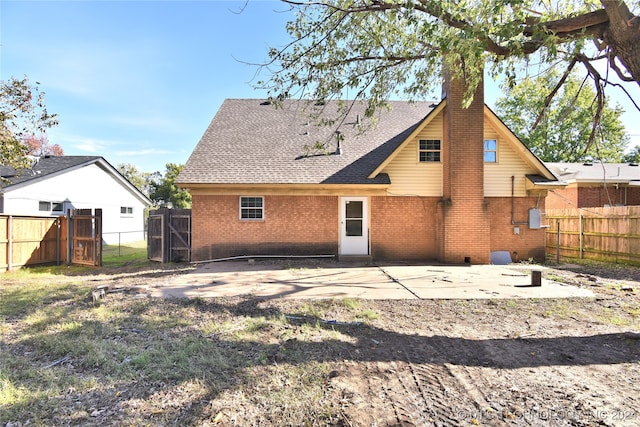 back of house with a patio area