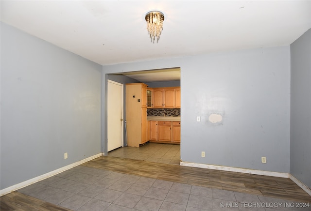 spare room featuring light hardwood / wood-style flooring