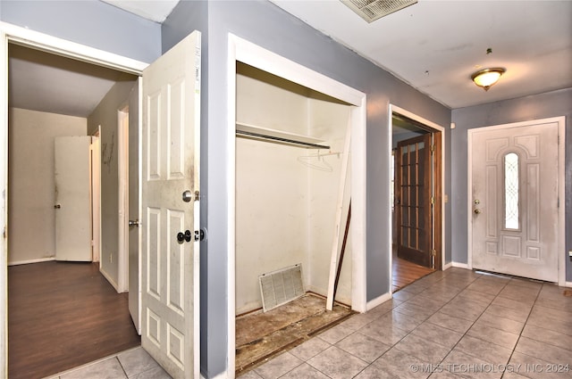 foyer entrance with light hardwood / wood-style floors