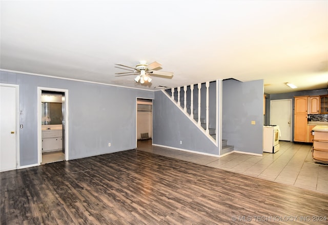 unfurnished living room with wood-type flooring and ceiling fan