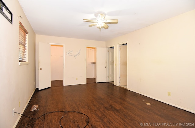 unfurnished bedroom featuring dark hardwood / wood-style flooring and ceiling fan