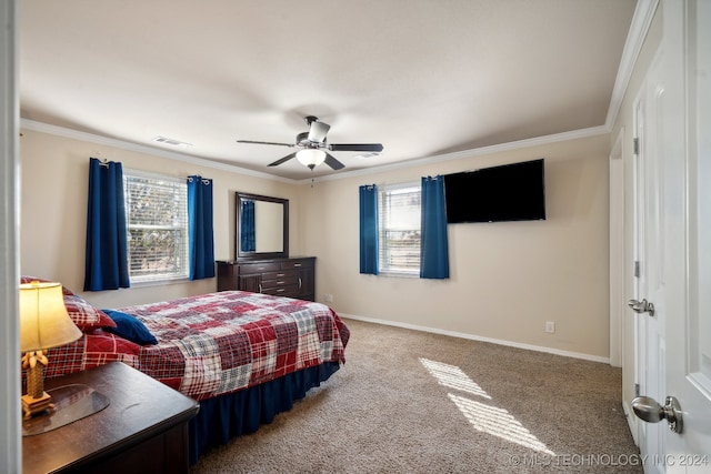 carpeted bedroom featuring ceiling fan and ornamental molding