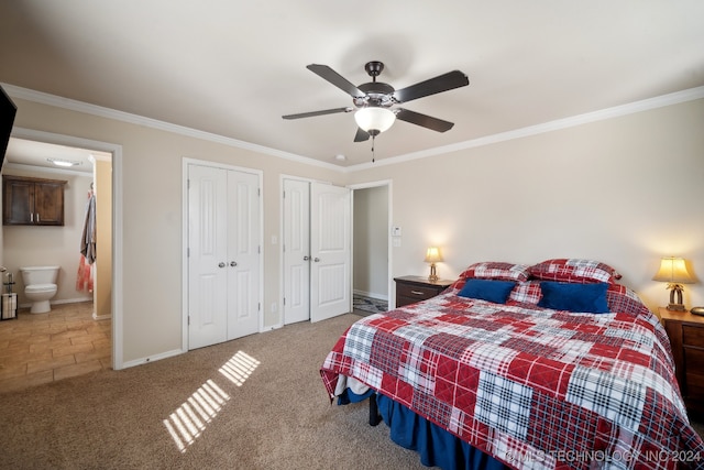 bedroom featuring connected bathroom, ceiling fan, multiple closets, crown molding, and carpet floors