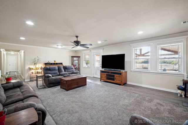 living room with ceiling fan, wood-type flooring, and ornamental molding