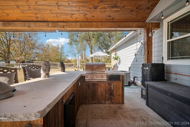 view of patio / terrace featuring central AC unit, area for grilling, and grilling area