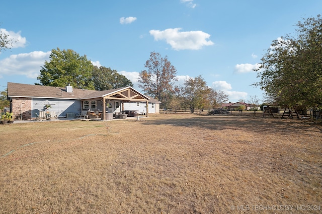 exterior space with a yard and a patio area