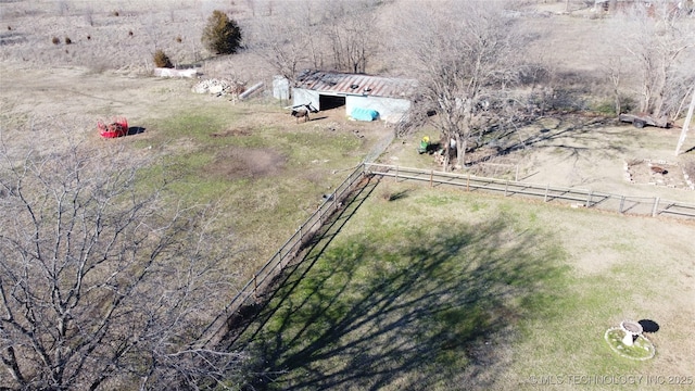 birds eye view of property with a rural view