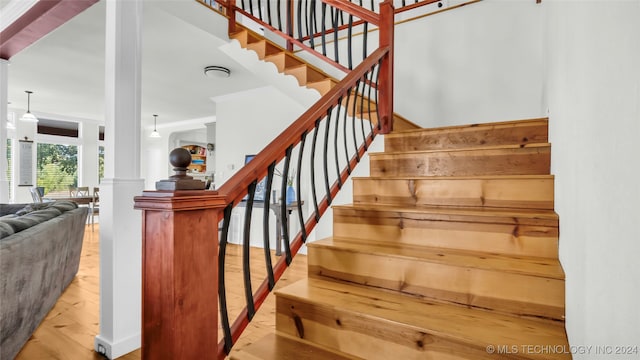 staircase featuring wood-type flooring