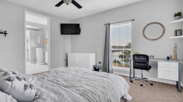 carpeted bedroom with ceiling fan and ensuite bathroom